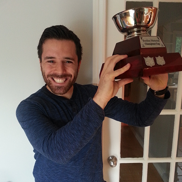 Elan Dubrofsky holding the KKUPFL championship trophy